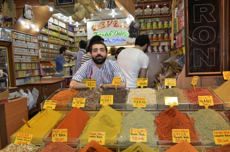 ISTANBUL - May 04: Seller posing in Egyptian Bazaar (Spice Bazaar) on May 04, 2013 in Istanbul, Turkey. Located in EminÃ¶nÃ¼ is the second largest covered shopping complex after Grand Bazaar. のeditorial素材