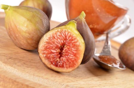 Figs, fig jam a spoon, a glass container