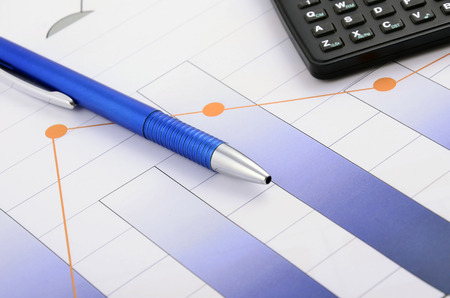 Business still life with pen and calculatorの写真素材