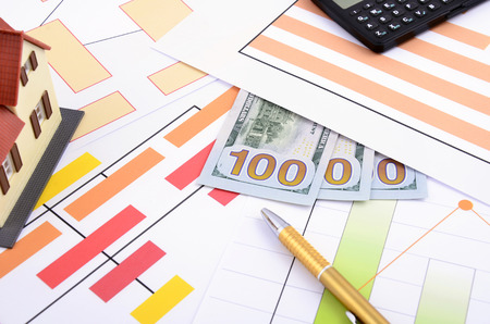 Business still life with pen, calculator,  diagramの写真素材