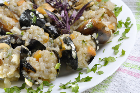 Risotto with mussels  in the plate on a  table/paella/,selective focusの写真素材