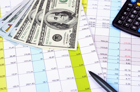 Business concept with calculator, pen,  glasses ,money and documents.Selective focusの写真素材