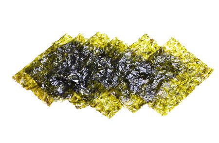 Crispy chips of nori . Japanese or korean roasted seaweed snack.Isolated on white background.の写真素材