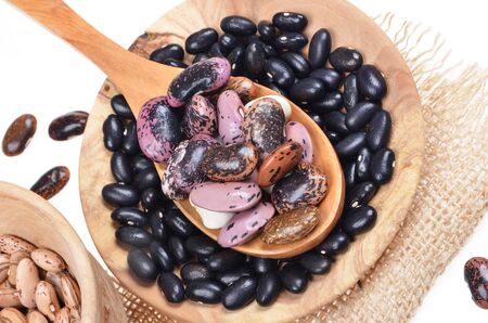 Mixed  Legumes Food and brown beans in wooden spoon, in wooden bowl.の写真素材