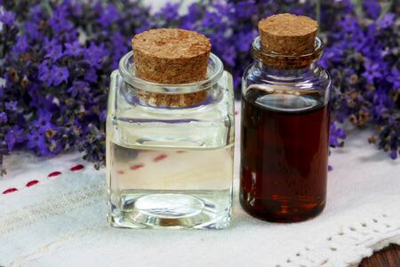 Glass bottle with lavender essential oil,lavender flowers
の写真素材