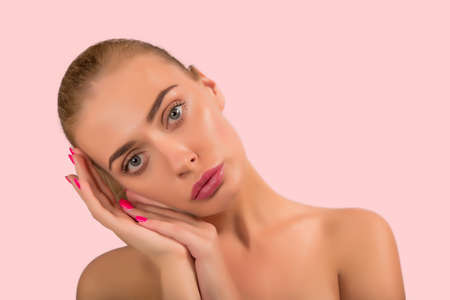 Portrait of a beautiful nude female girl model big lips on white background spaの写真素材