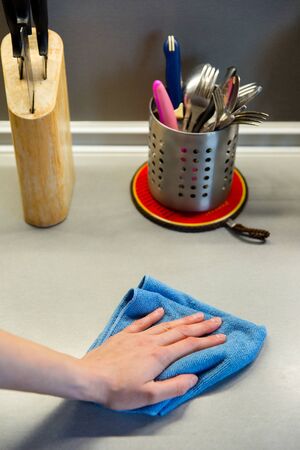 Cleaning kitchen with sponge, housework and housekeeping