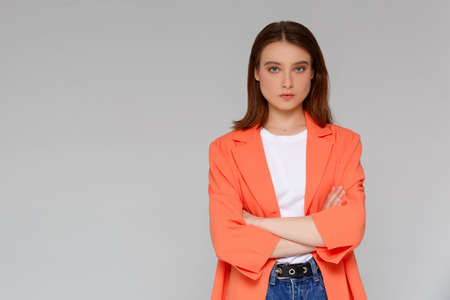 Attractive confident creative good-looking female bossy employee cross arms chest self-assured pose smiling assertive ready accomplish goals feeling lucky standing monochromatic backgroundの写真素材