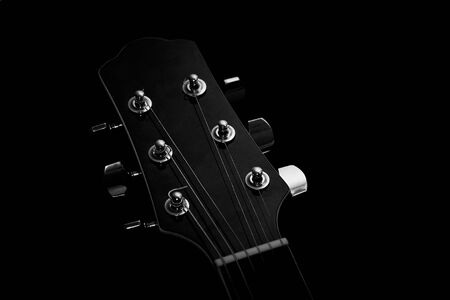 Acoustic guitar on black backgroundの写真素材