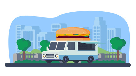 Mobile shop for fast food sale. Burger truck in park.の写真素材