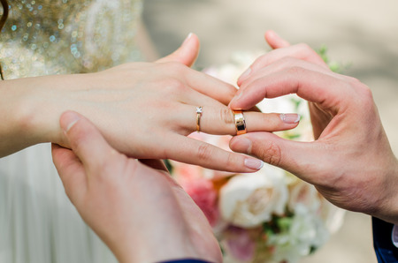 The bride, groom, wedding ringsの写真素材