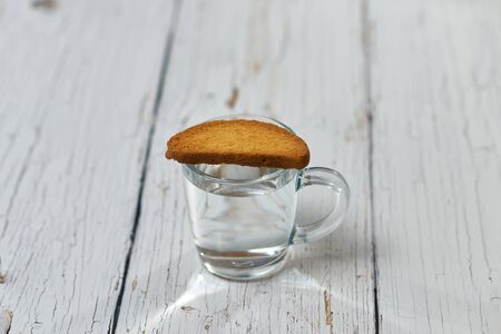 A bottle of water, crackers, drying on the background of boards for a healthy lifestyle.の写真素材