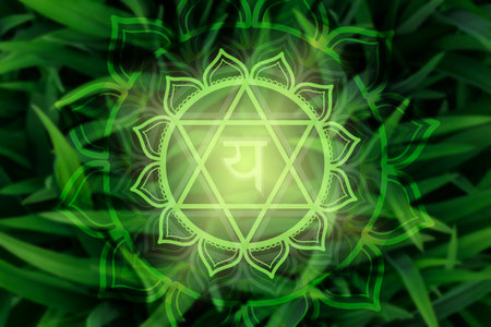 Anahata chakra symbol on green natural background. Mandala flower.
