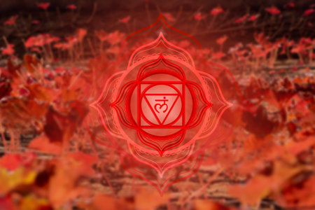 Muladhara chakra symbol on bright orange natural background. Colorful poster with red mandala.の写真素材
