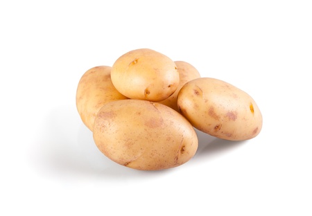 Raw potatos isolated on whiteの写真素材