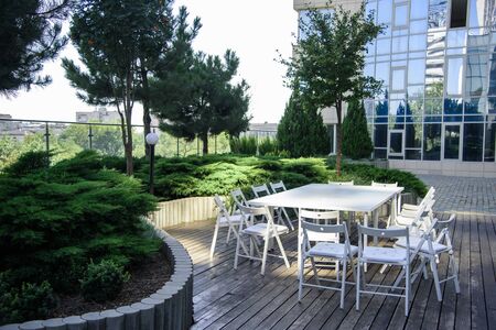 White table with chairs in the Park on the woodの写真素材
