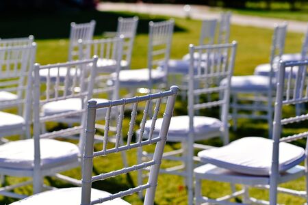 Wedding chairs on green grassの写真素材