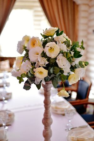 Beautiful flowers on table in wedding day with white flowers. Rose, eustoma, tulip, eucalyptusの写真素材