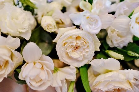 Beautiful flower arrangement of roses in a vase. Beautiful set up for the wedding ceremony. Rose, eustoma, tulip, eucalyptusの写真素材