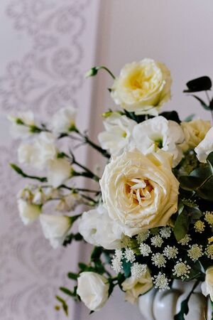 Beautiful flower arrangement of roses in a vase. Beautiful set up for the wedding ceremony. Rose, eustoma, tulip, eucalyptusの写真素材