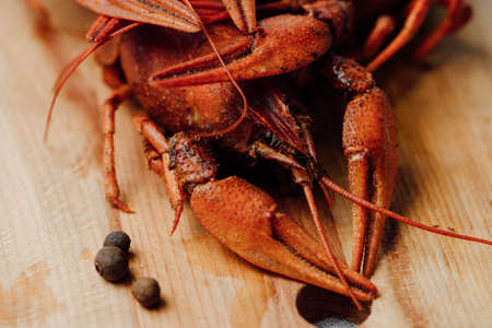 boiled crayfish on a wooden tableの写真素材