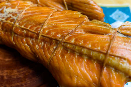 kipper fish on a plate on a wooden table