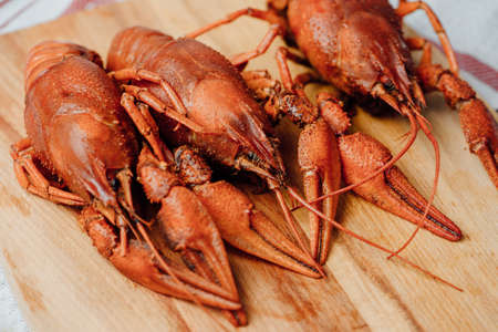 boiled crayfish on a wooden tableの写真素材