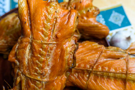 kipper fish on a plate on a wooden table