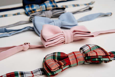Set of different bow tie on light background.の写真素材