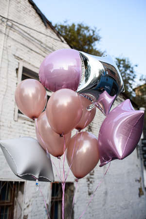 Colorful helium balloons outdoorsの写真素材
