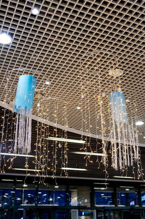 Magical Christmas winter decor with glowing blue garlandsの写真素材