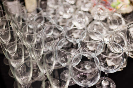 Shine crystal glasses shot on black wooden tableの写真素材