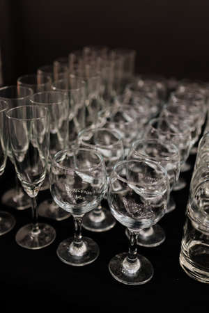 Shine crystal glasses shot on black wooden tableの写真素材