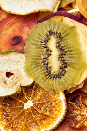 Close-up mix sliced dried fruits. Kiwi, orange, apple. Vegetarian lifestyle.の写真素材