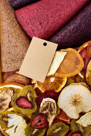 Close-up mix dried fruits and mix fruit pastille marshmallow with craft paper card. Vegetarian lifestyle.の写真素材
