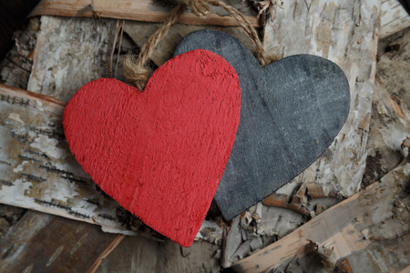 Handmade wooden hearts on old wood backgroundの写真素材