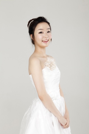 Lovely girl dressed in white short dressの写真素材