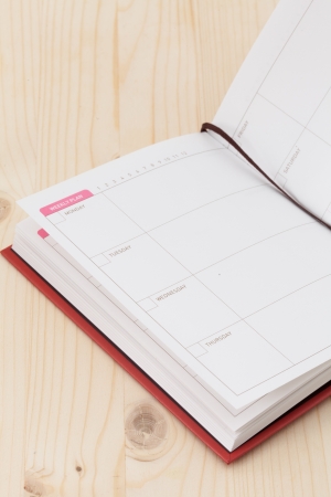 White open notebook on wood background の写真素材