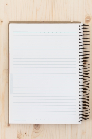 Blank paper tablet on wood backgroundの写真素材