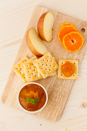 Marmalade jam in a jar with orange fruitの写真素材