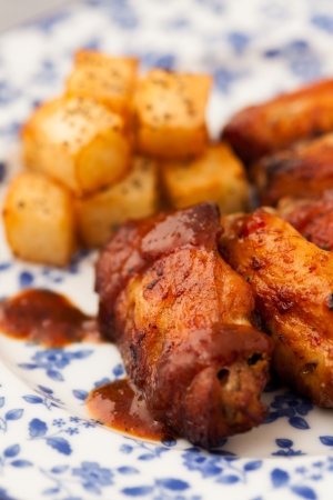 Chicken Wings on a Plate with potatoの写真素材