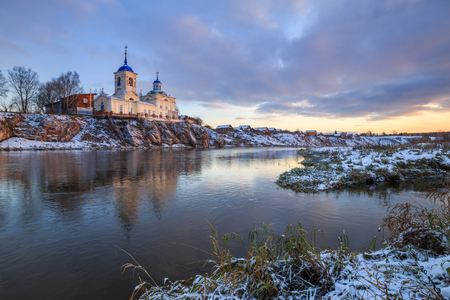 orthodox church on the river, sunset on the riverの写真素材
