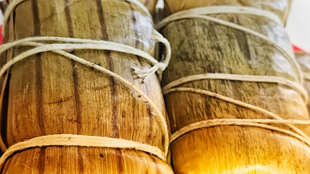 photo of traditional food from Indonesia made from sticky rice wrapped in banana leavesの写真素材