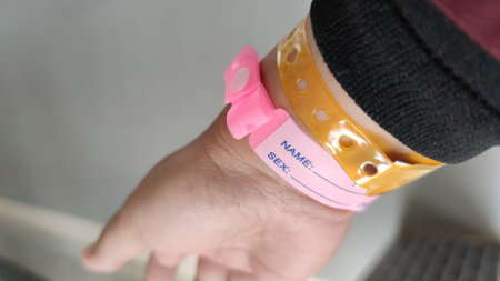Close up of woman hand with pink wrist bandage on her wristの写真素材