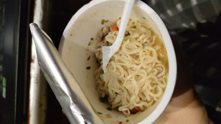 instant noodle in a plastic cup, close-up.の写真素材