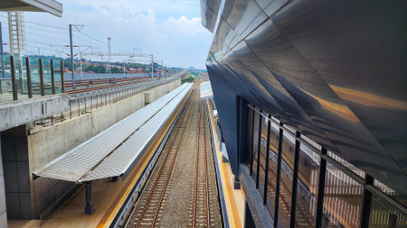 a train station with a train on the tracks