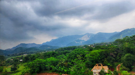 Beautiful view of the mountains and the village in the rain.の写真素材