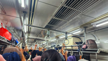 Interior of a modern train with people inside. Blurred motion