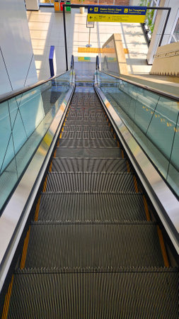 Escalator in the modern airport, London, England, UK