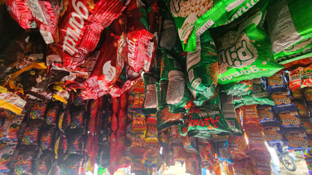 a large display of candy and snacks in a store